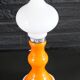 Table lamp or bedside lamp from the 1960s-70s in orange and chrome.