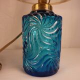 Table lamp with king blue and gold glass foot and machineinor action lampshade