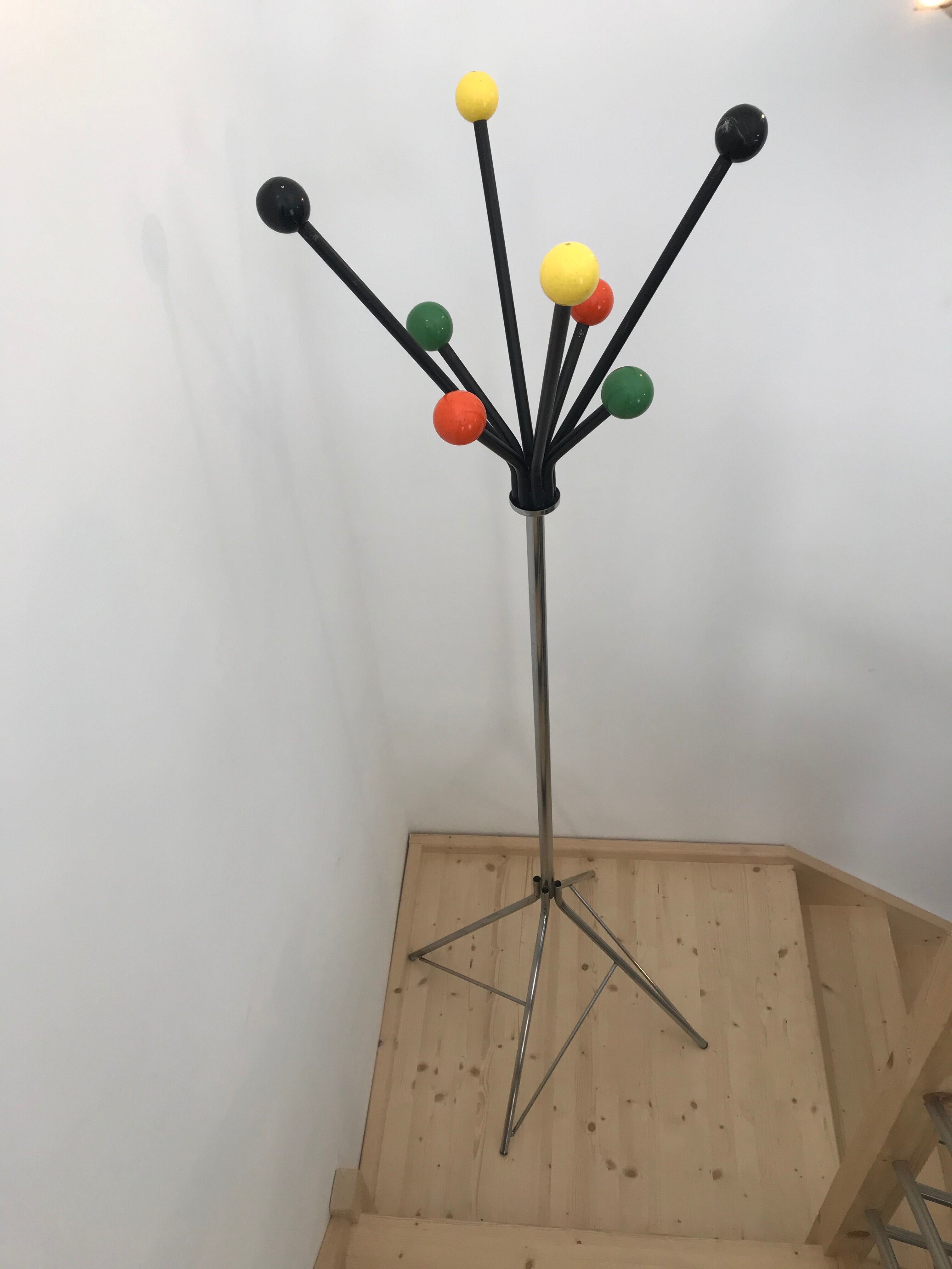 Wearing chrome parrot coat, black and multicolored balls