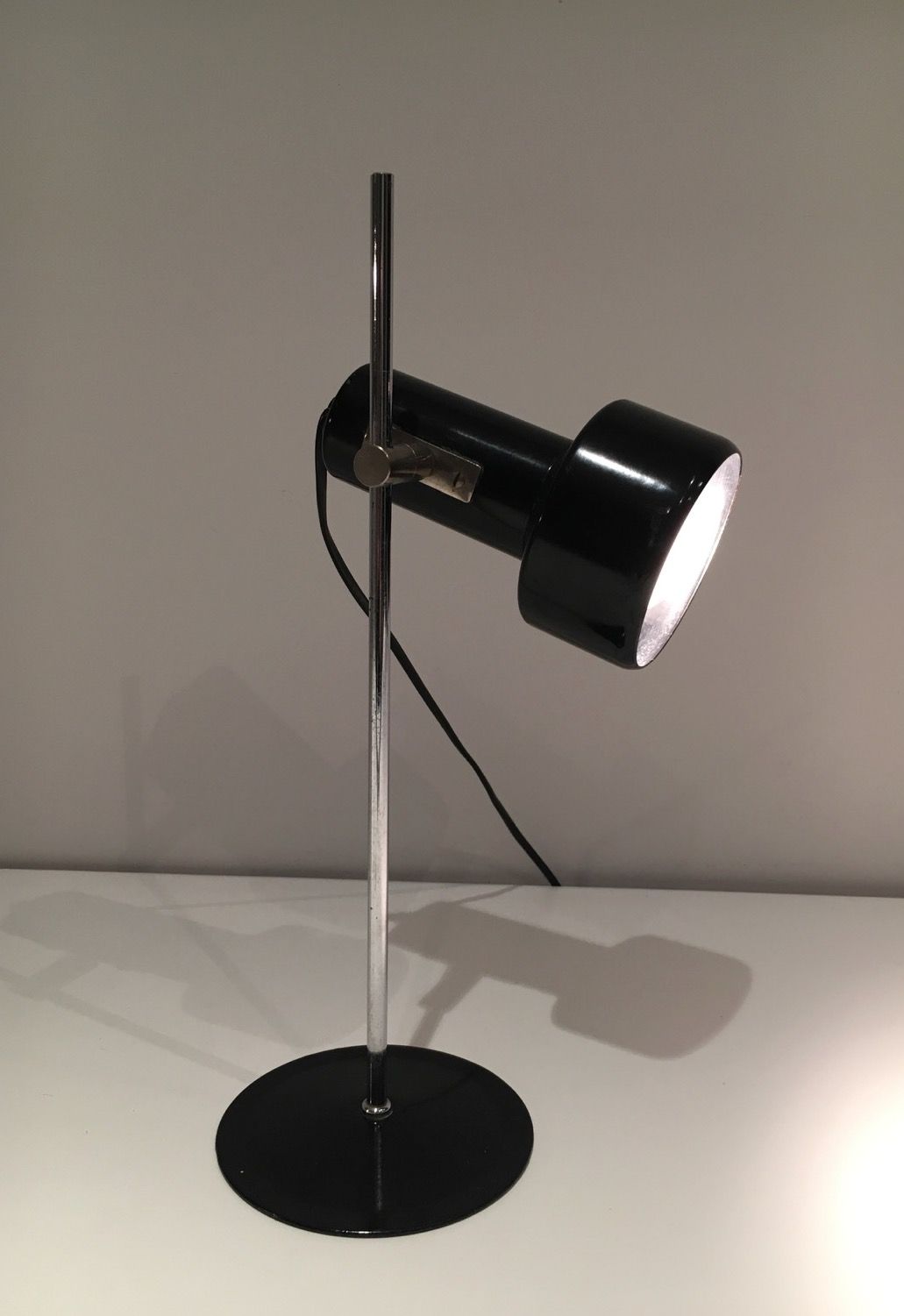 Adjustable lamp in black lacquered metal and chrome. French work. Circa 1970.