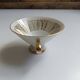 Solitaire tea cup, saucer, and dessert plate in white and gold.