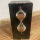 Pierre Giraudon resin hourglass paperweight