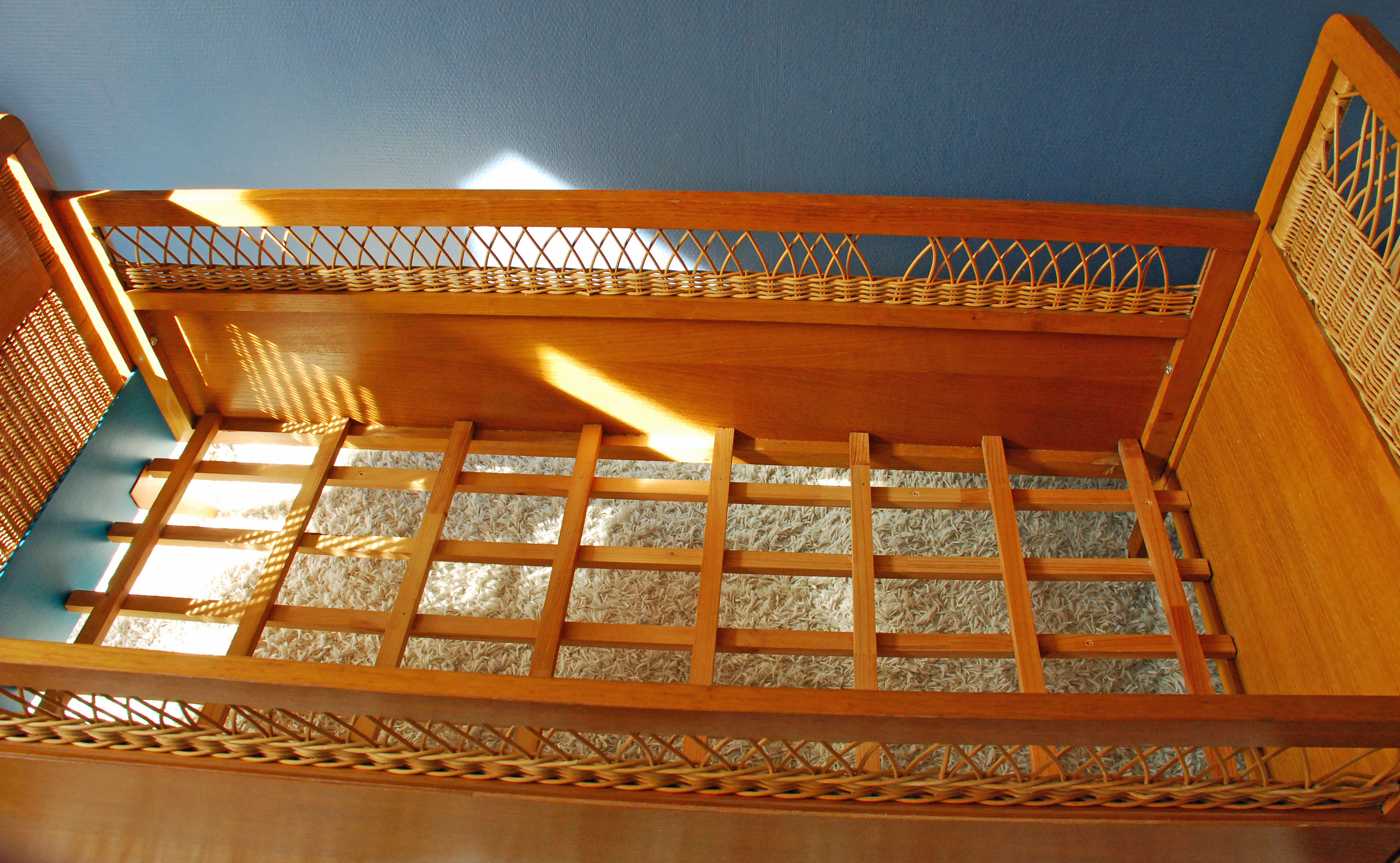 Wooden bed and vintage rattan