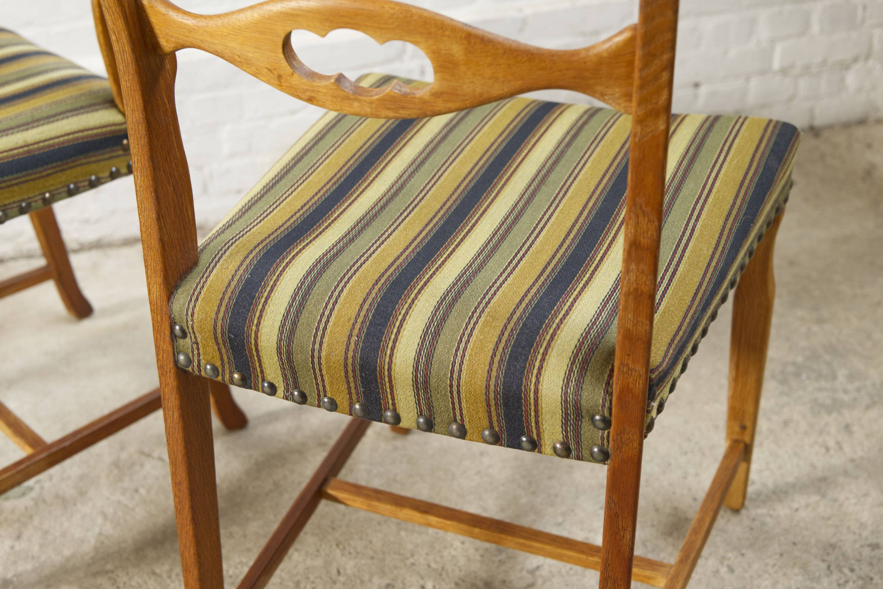 Set of four oak and wool dining room chairs by Henning Kjaernulf, 1960's