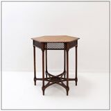 Hexagonal pedestal table or side table with a lattice structure and star pattern.