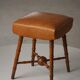 Turned wooden stool with leather seat, mid-20th century, Danish modern.
