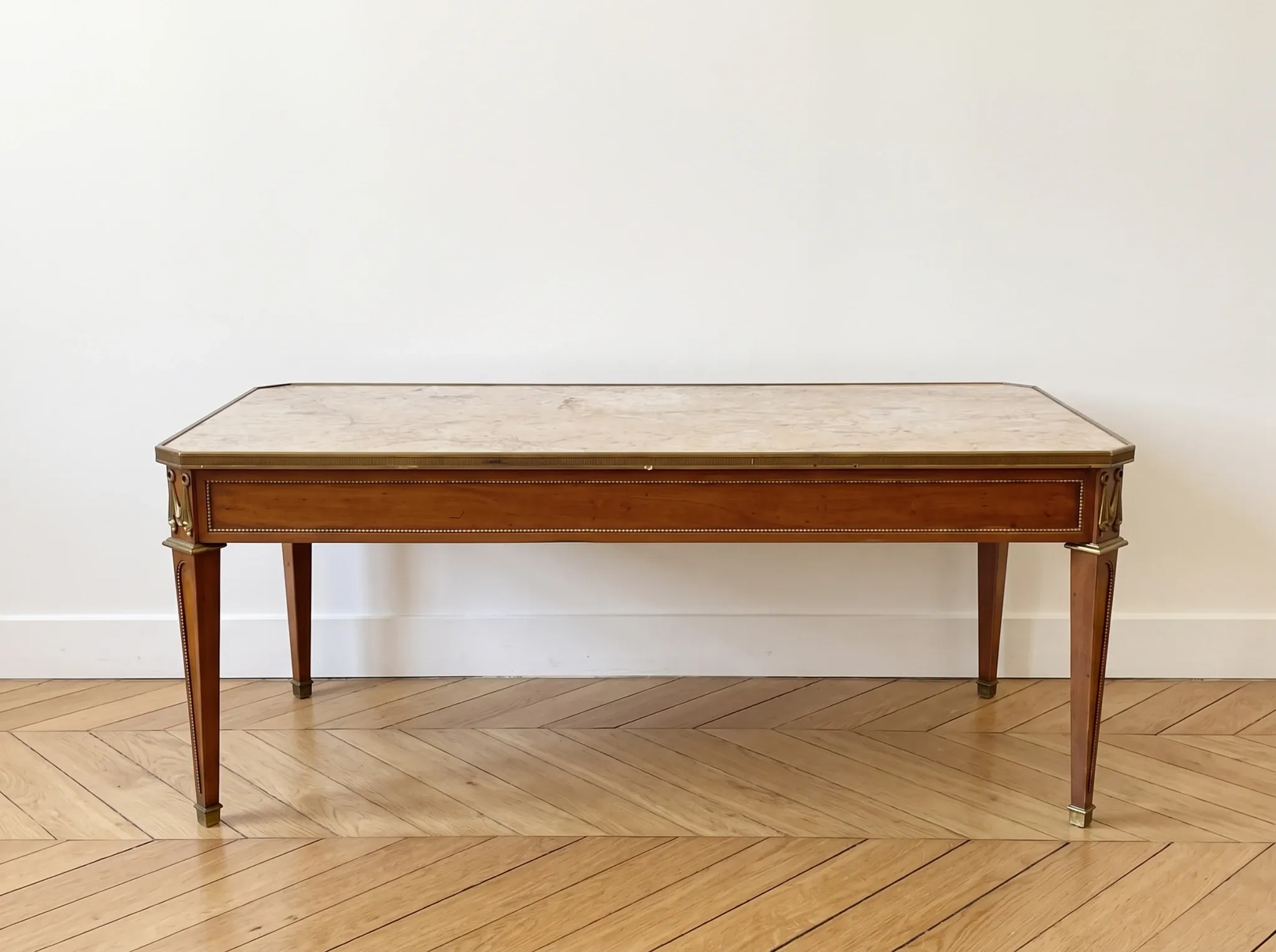 Louis XVI style coffee table in wood and marble with bronze ornaments.
