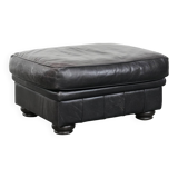 Large and timeless black ottoman made of cowhide leather in English style