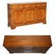 Vintage mahogany buffet with three drawers and shelves.