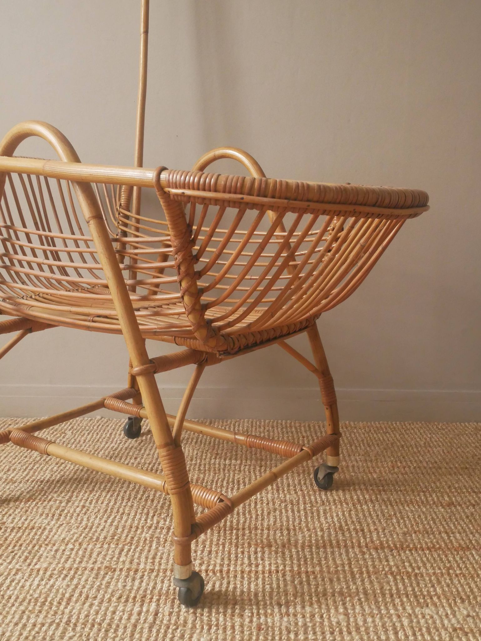 Vintage rattan cradle bassinet on wheels retro Scandinavian design baby bed