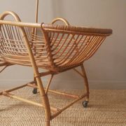Vintage rattan cradle bassinet on wheels retro Scandinavian design baby bed
