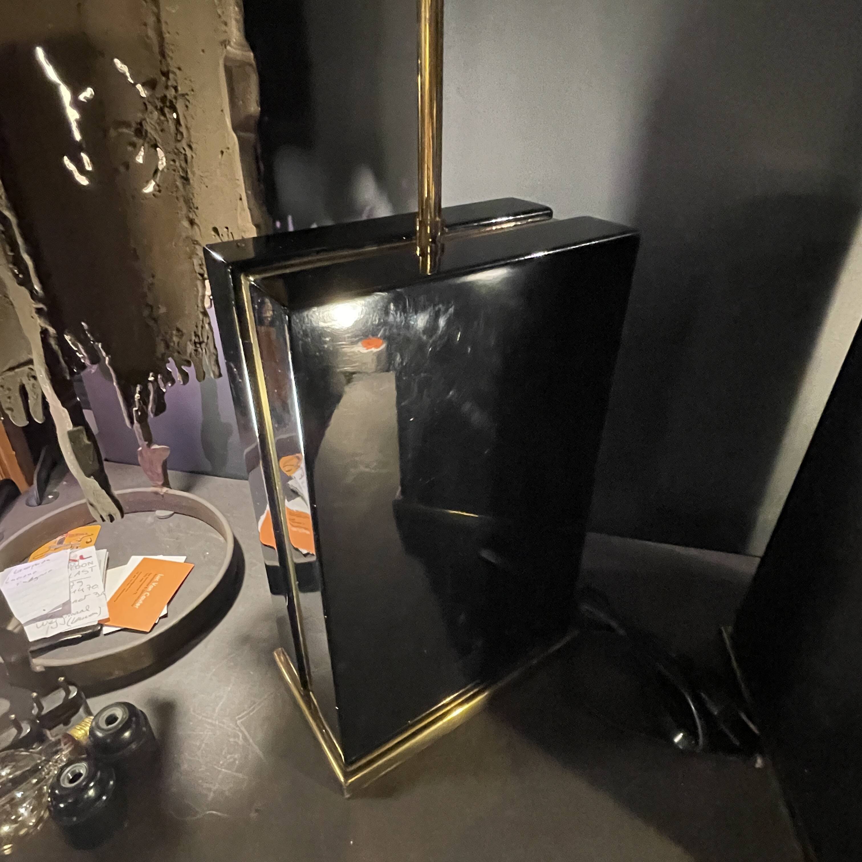 Pair of black lacquered and brass table lamps, circa 1970