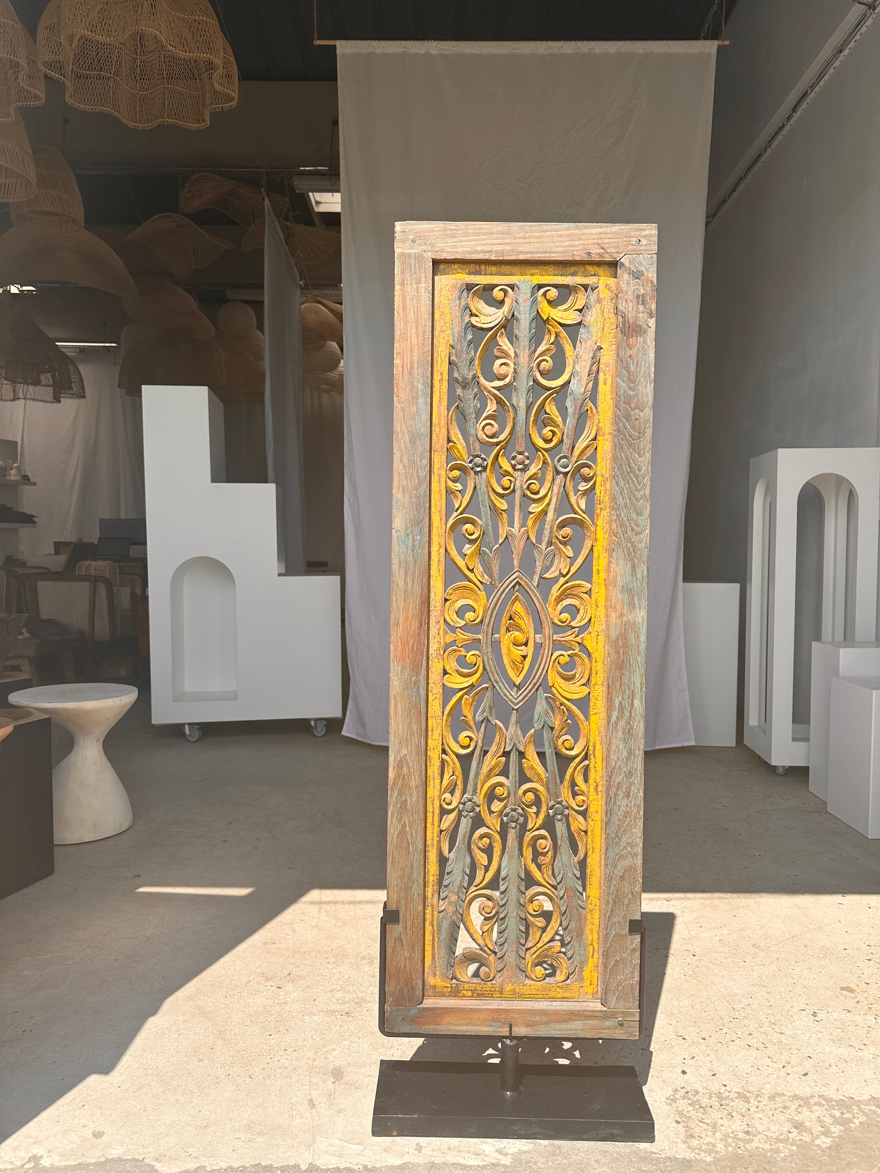 Rectangular Indonesian construction element with blue and yellow plant in carved wood