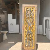 Rectangular Indonesian construction element with blue and yellow plant in carved wood