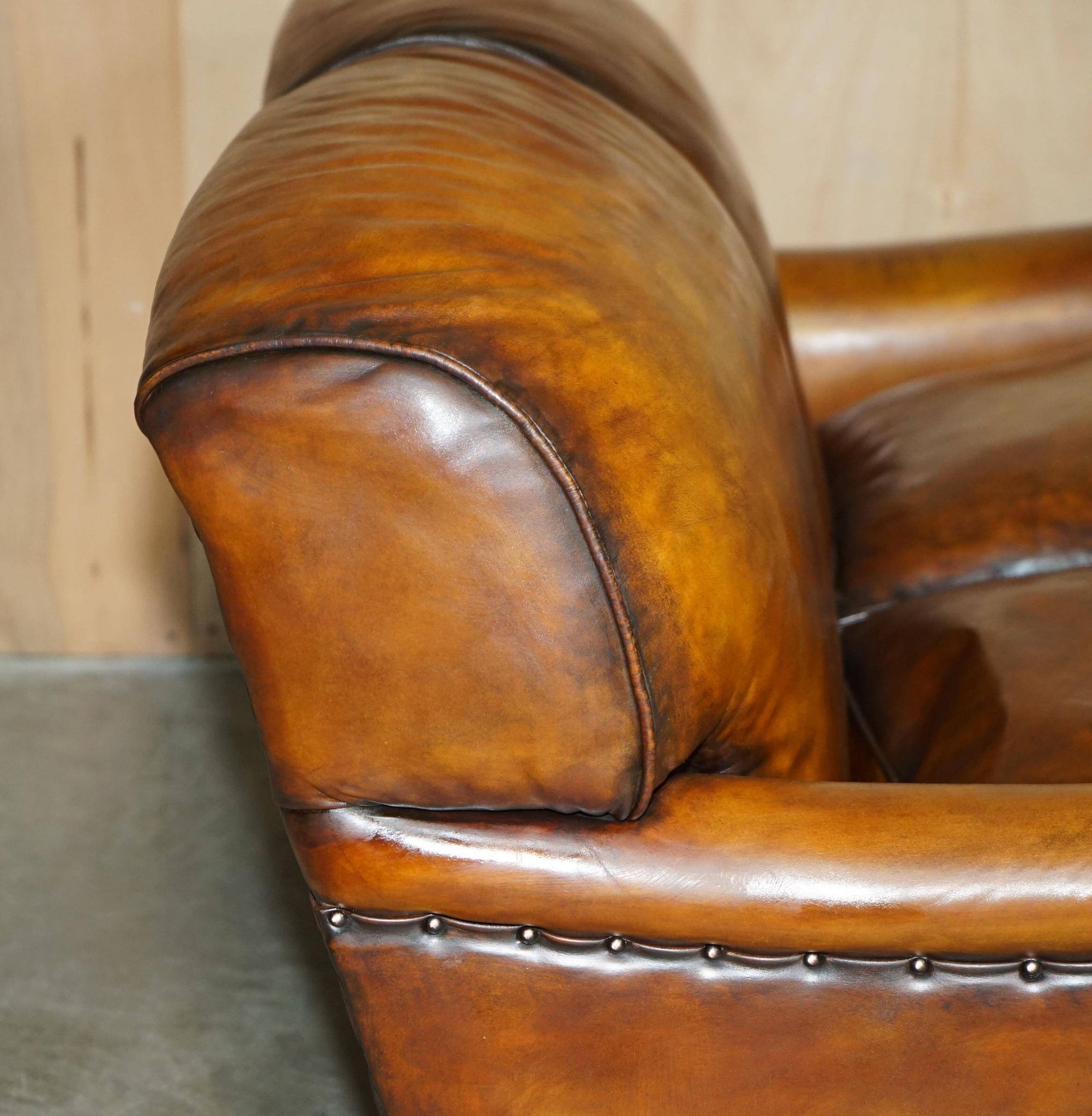 Howard & Son restored leather canapé, width 145 cm