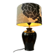 Small Space Age table lamp with a porcelain base and black and white flower shade.