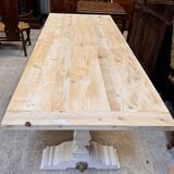 Industrial table with sandblasted top and bleached legs.