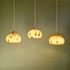 Trio of Art Deco pendant lights in marbled opaline glass, 1920s-30s