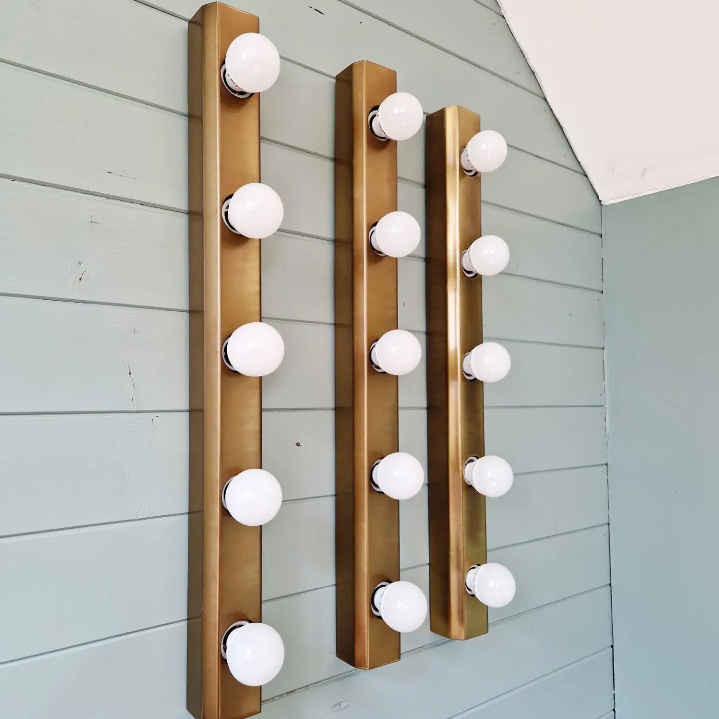 Set of three wall sconces in solid brass, 1970s-80s.