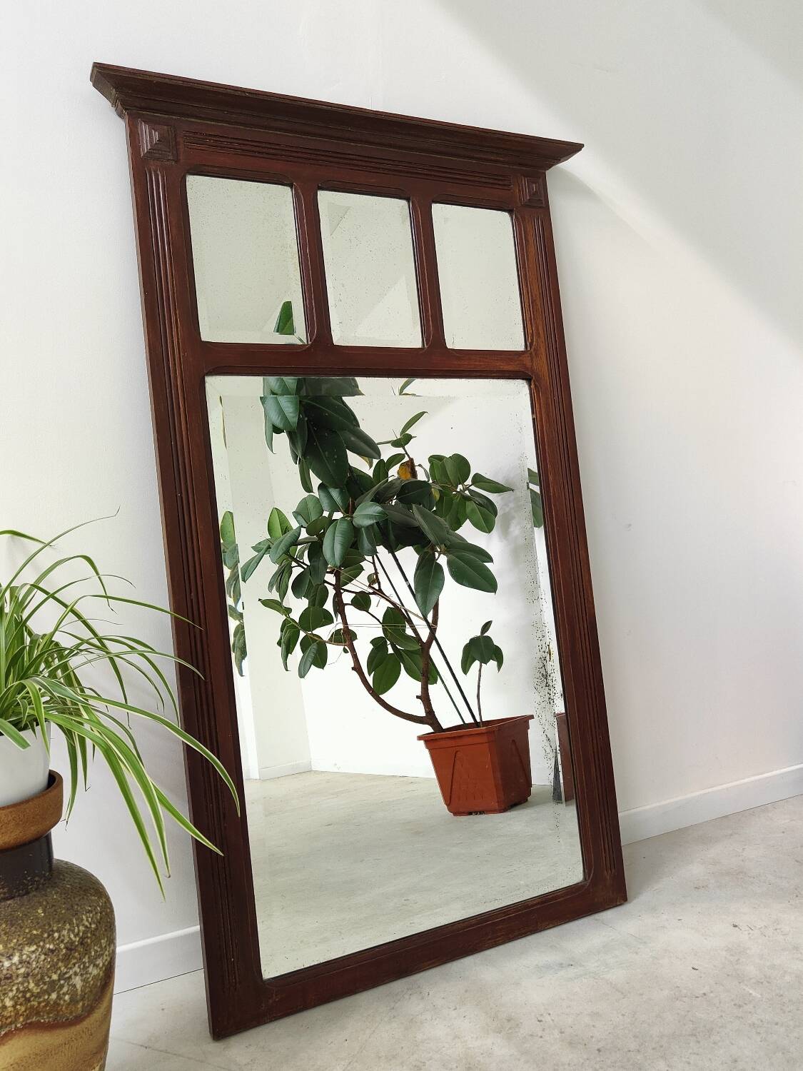 Antique beveled mirror on a wooden frame, 1930