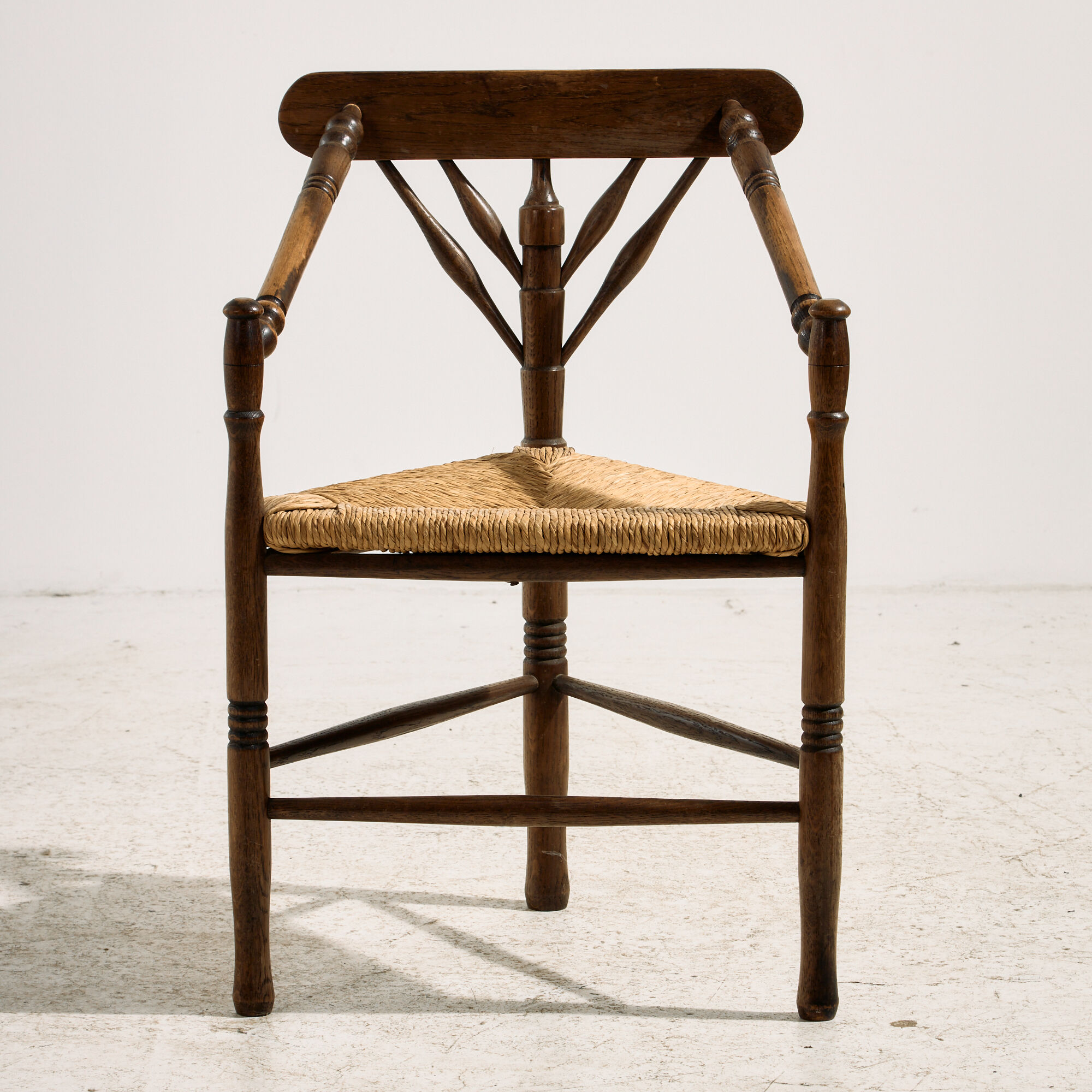 Oak armchair with three legs