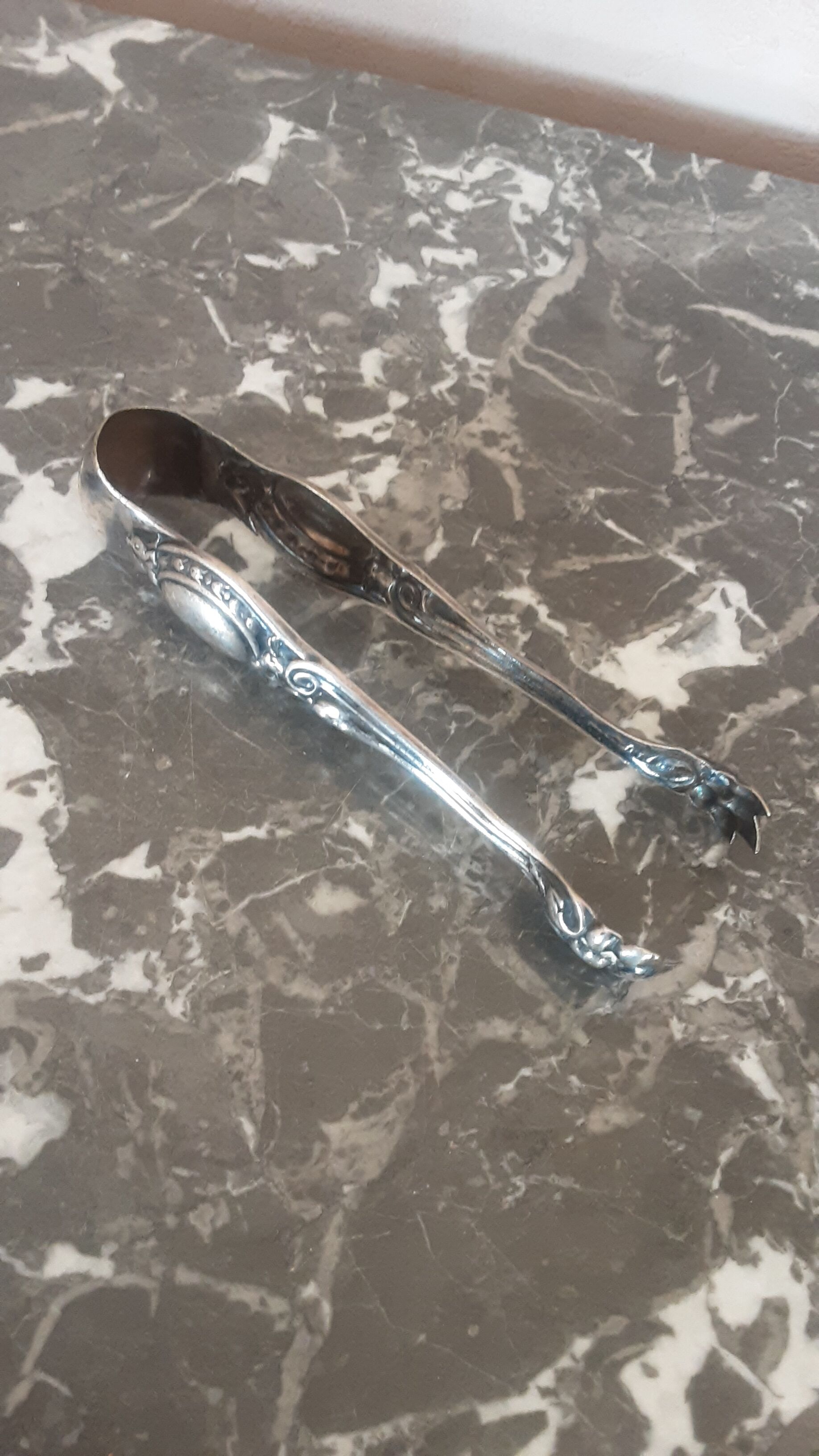 Antique silver metal sugar clamp