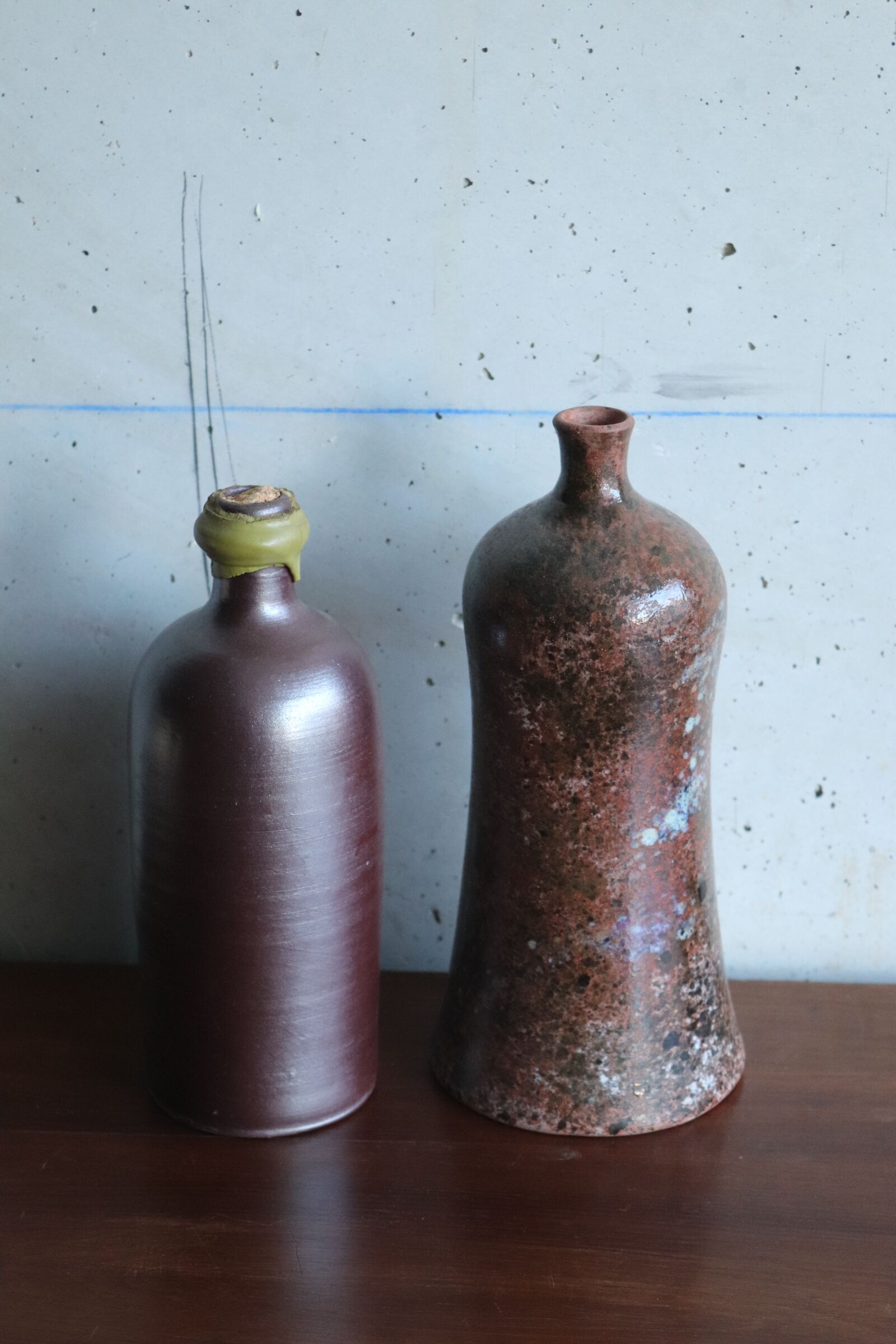 2 vintage ceramic bottles