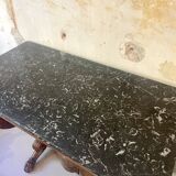 Console inlaid with black marble and lion's paw legs.