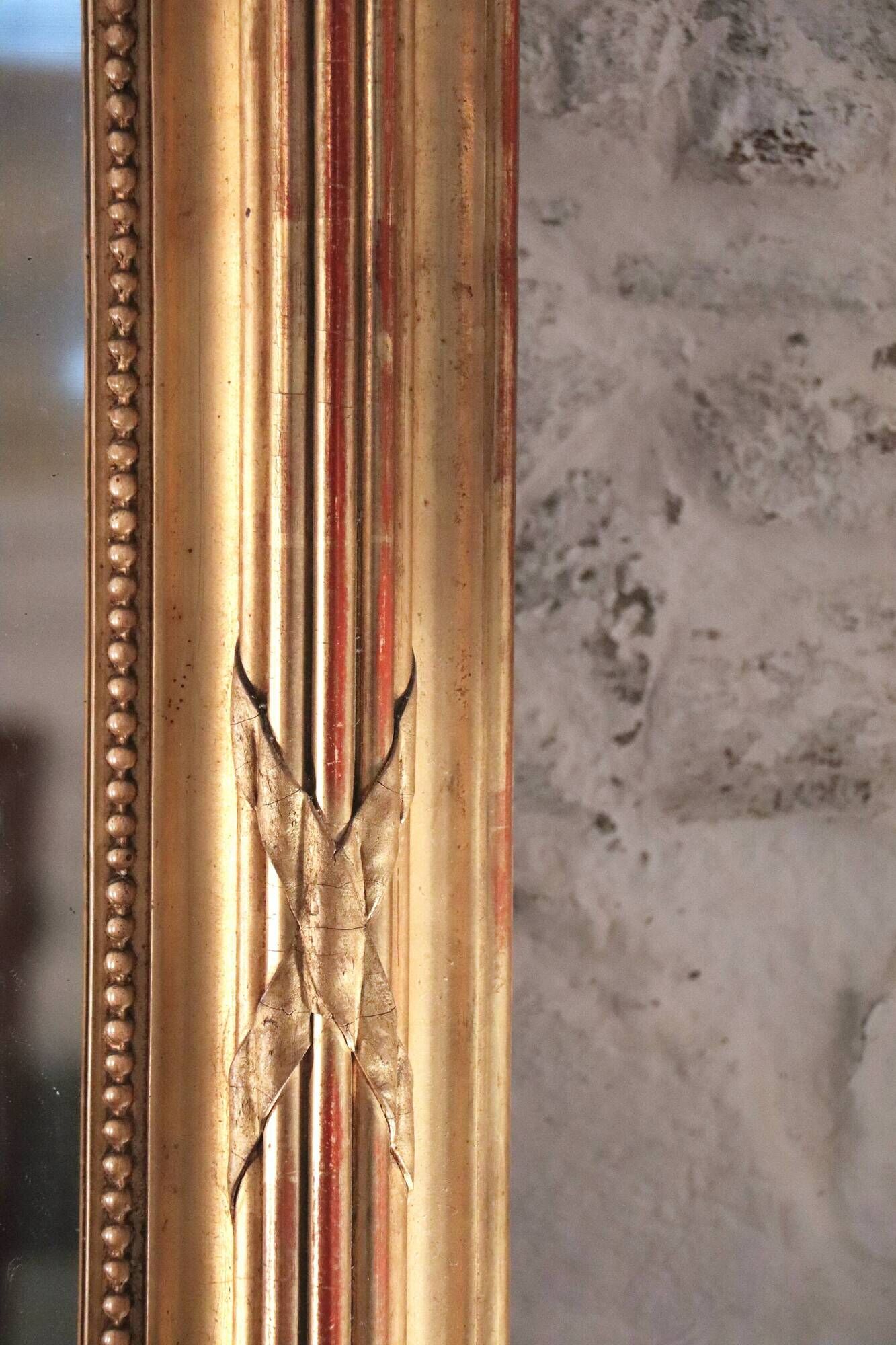 Manor house trumeau mirror in gilded wood, 19th century