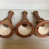 Trio of large brown and gold candlesticks