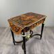 Writing table in Napoléon III style with marquetry and gilded bronzes, 19th century.