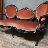 Very large Louis XV style mahogany banquette with medallions from the 19th century.