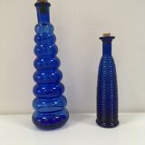 Lot of 2 soliflore vases in twisted blue glass