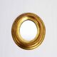 Golden oval mirror