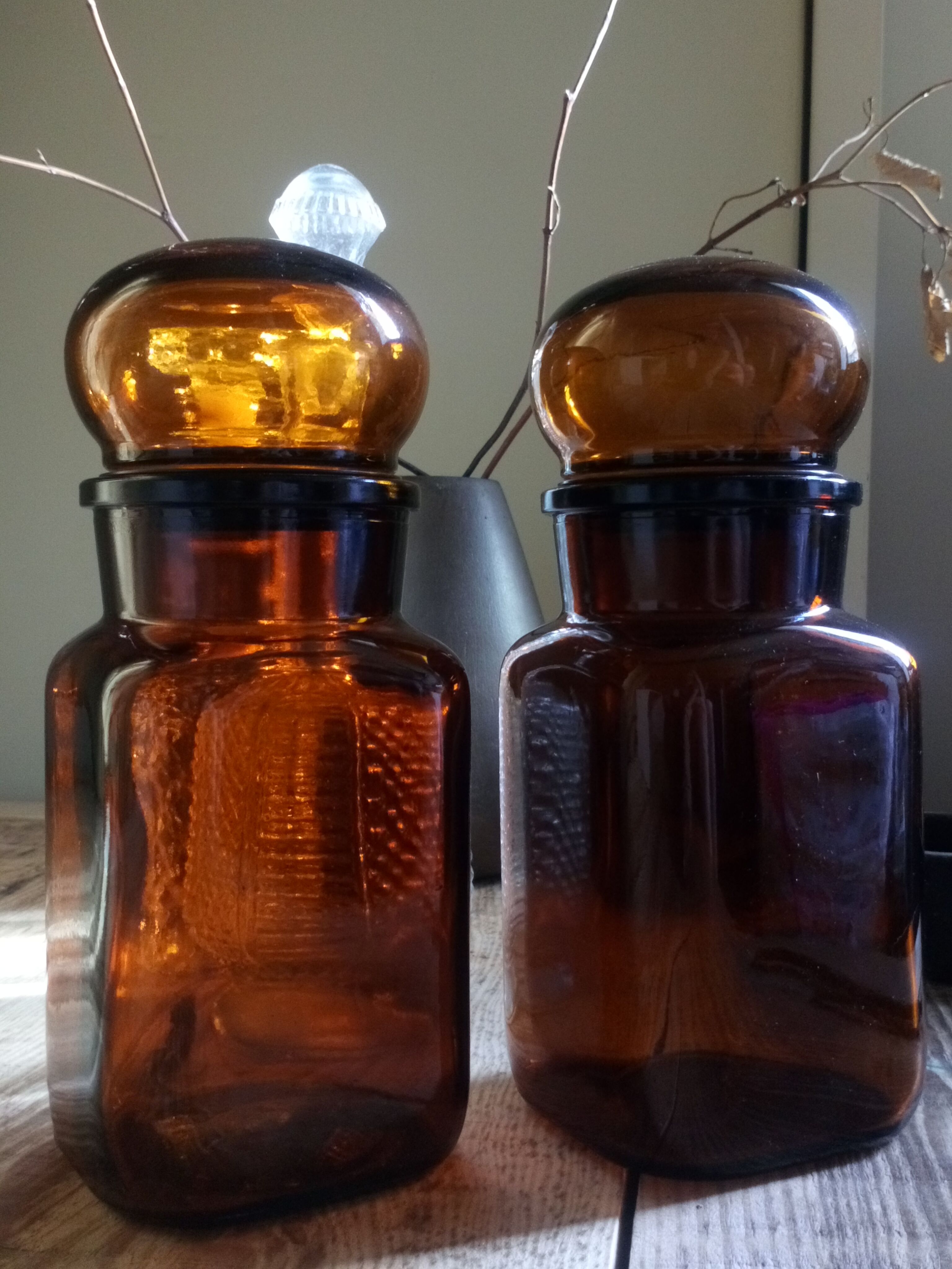 Duo of vintage apothecary bottles in amber glass