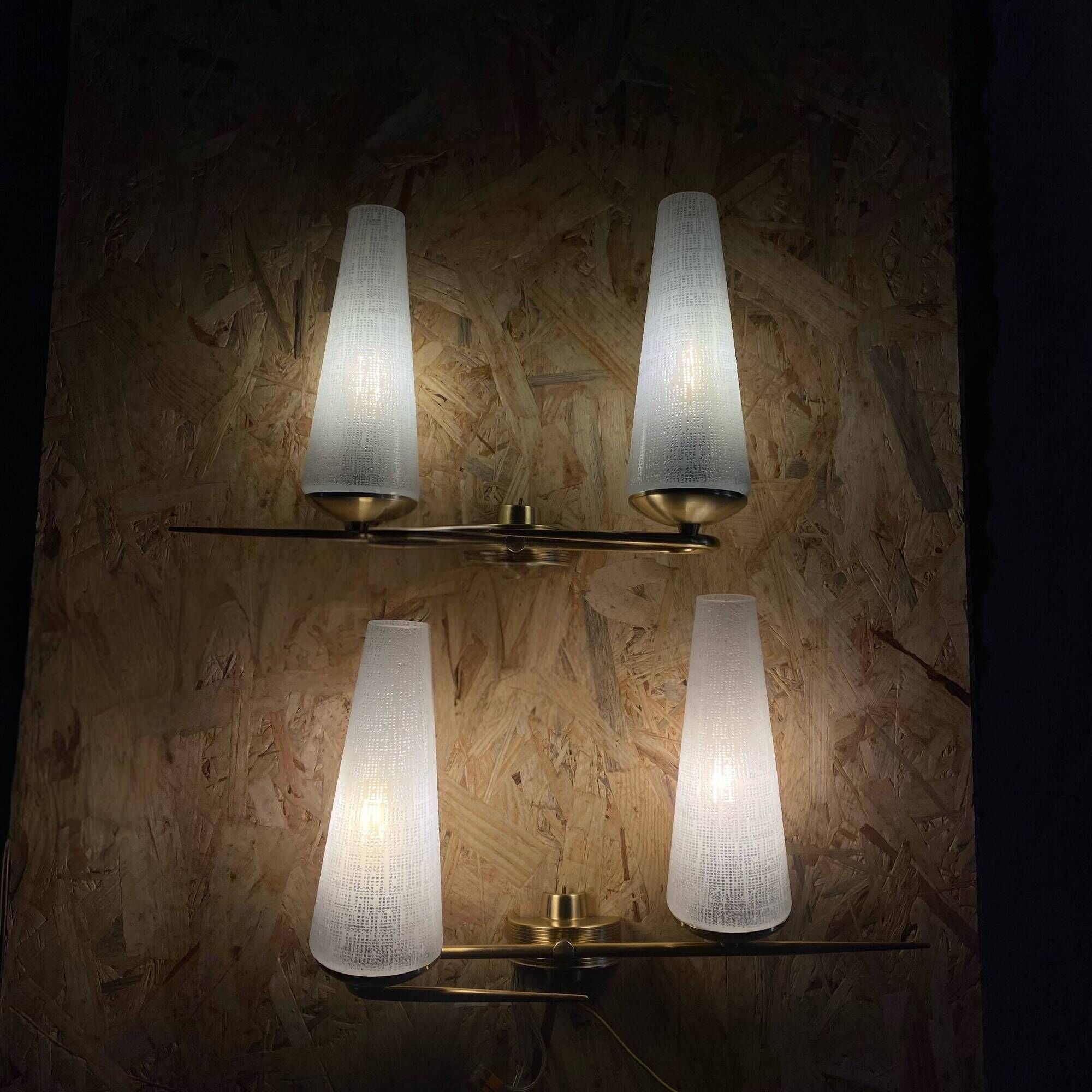 Pair of vintage double wall lights in brass with white ribbed glass tulips.