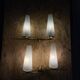 Pair of vintage double wall lights in brass with white ribbed glass tulips.