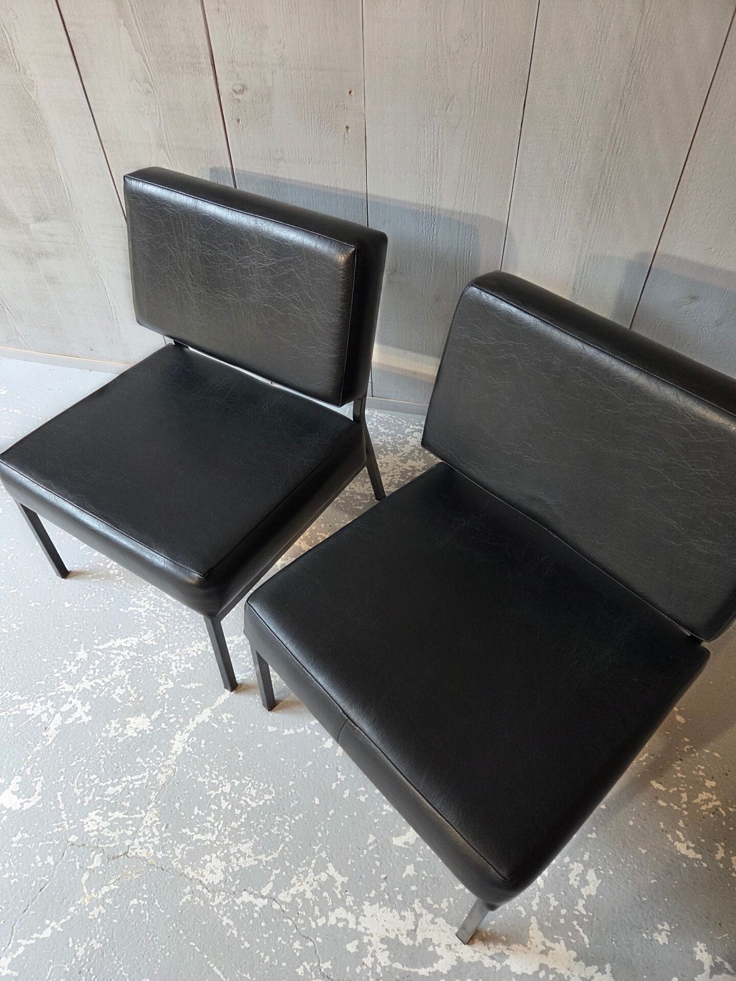 2 faux leather armchairs