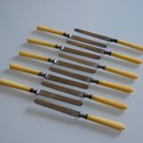 11 antique dessert knives from the 19th century with ivory-colored handles and a monogram