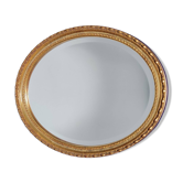 Miroir mural ovale biseauté vintage avec cadre doré vieilli