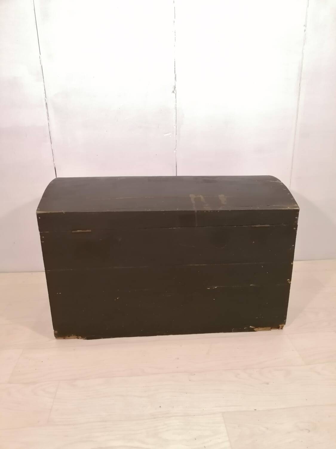 Large travel trunk in blackened wood
