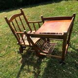 Old baby high chair in wood and canework