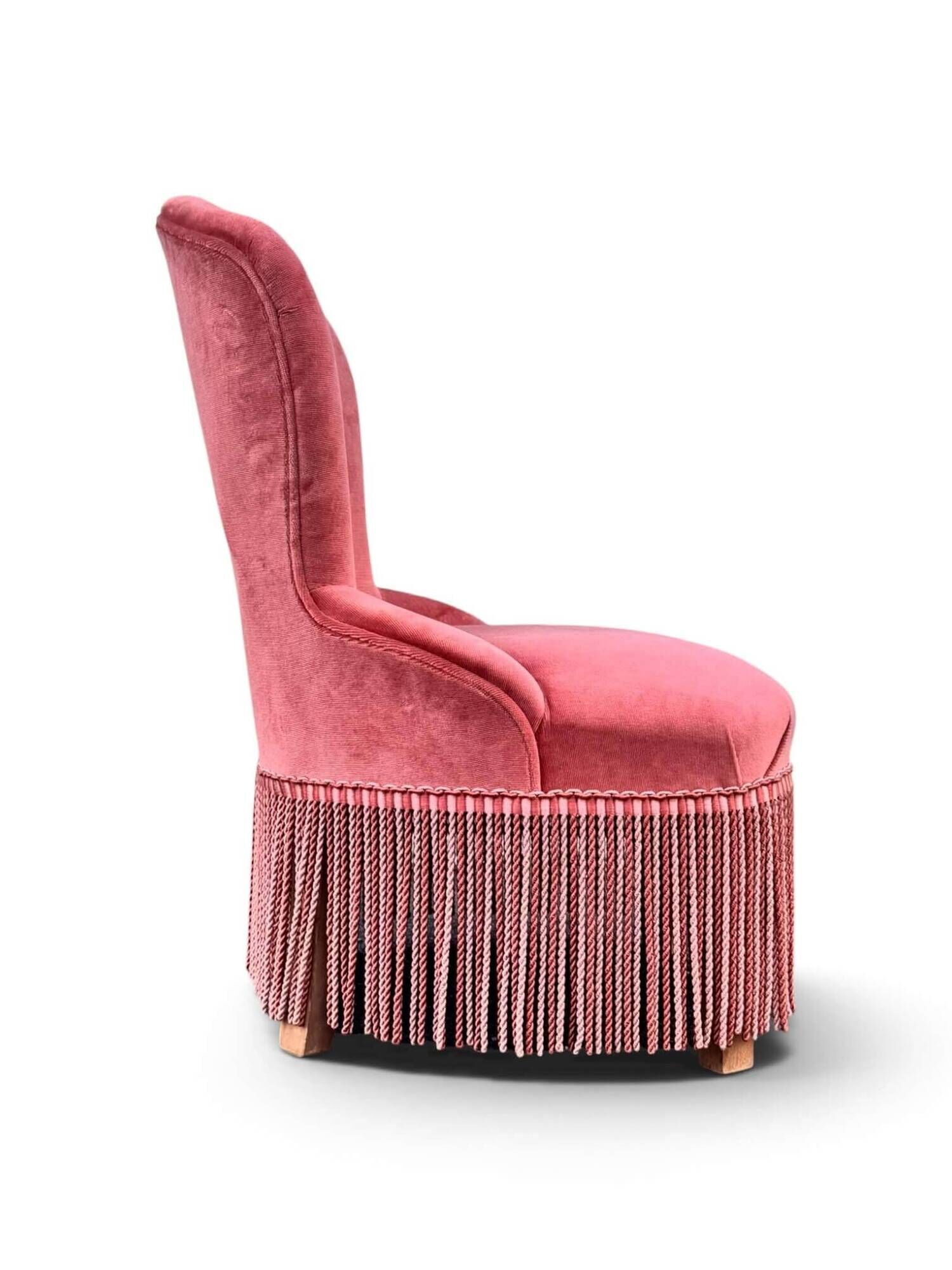 Vintage pink velvet fringed armchair