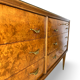 Veneered burl walnut chest of drawers with light warm brown glass top