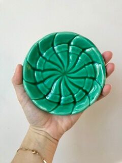 Duo of green slip bottle coasters signed marjac bauzil 50s