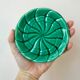 Duo of green slip bottle coasters signed marjac bauzil 50s