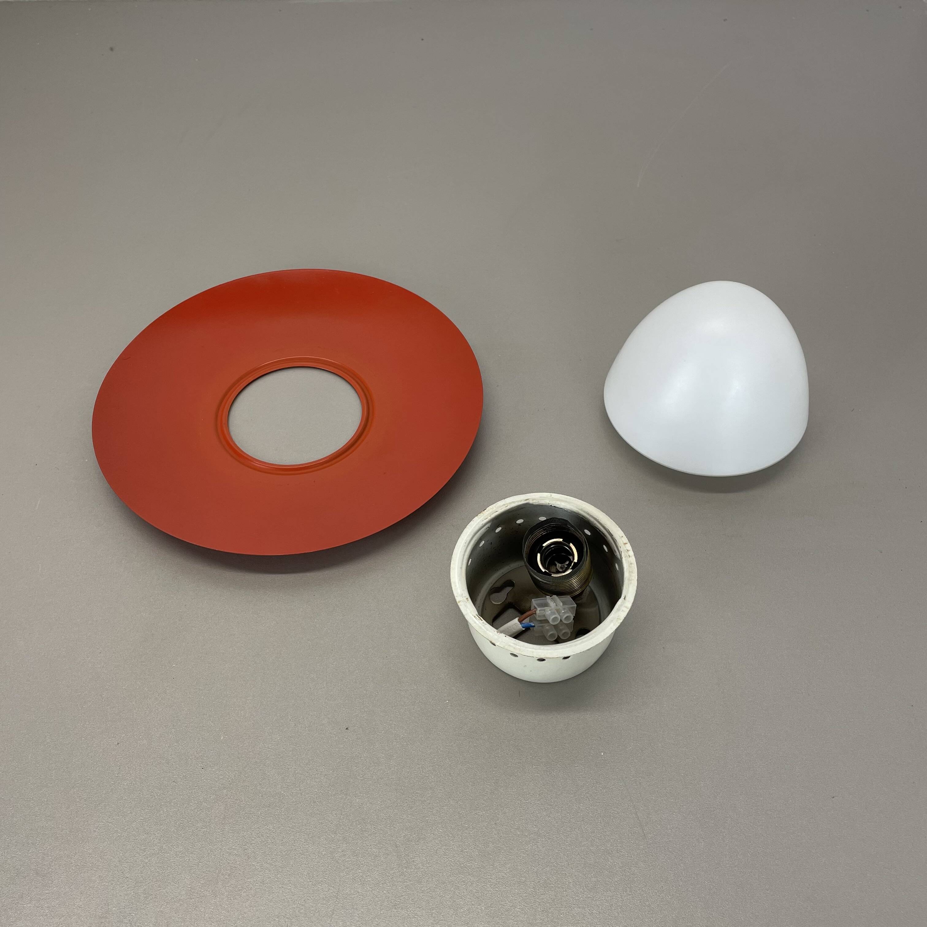 Round red wall light in metal and opaline glass in the Stilnovo style, 20 cm, Italy, 1960s