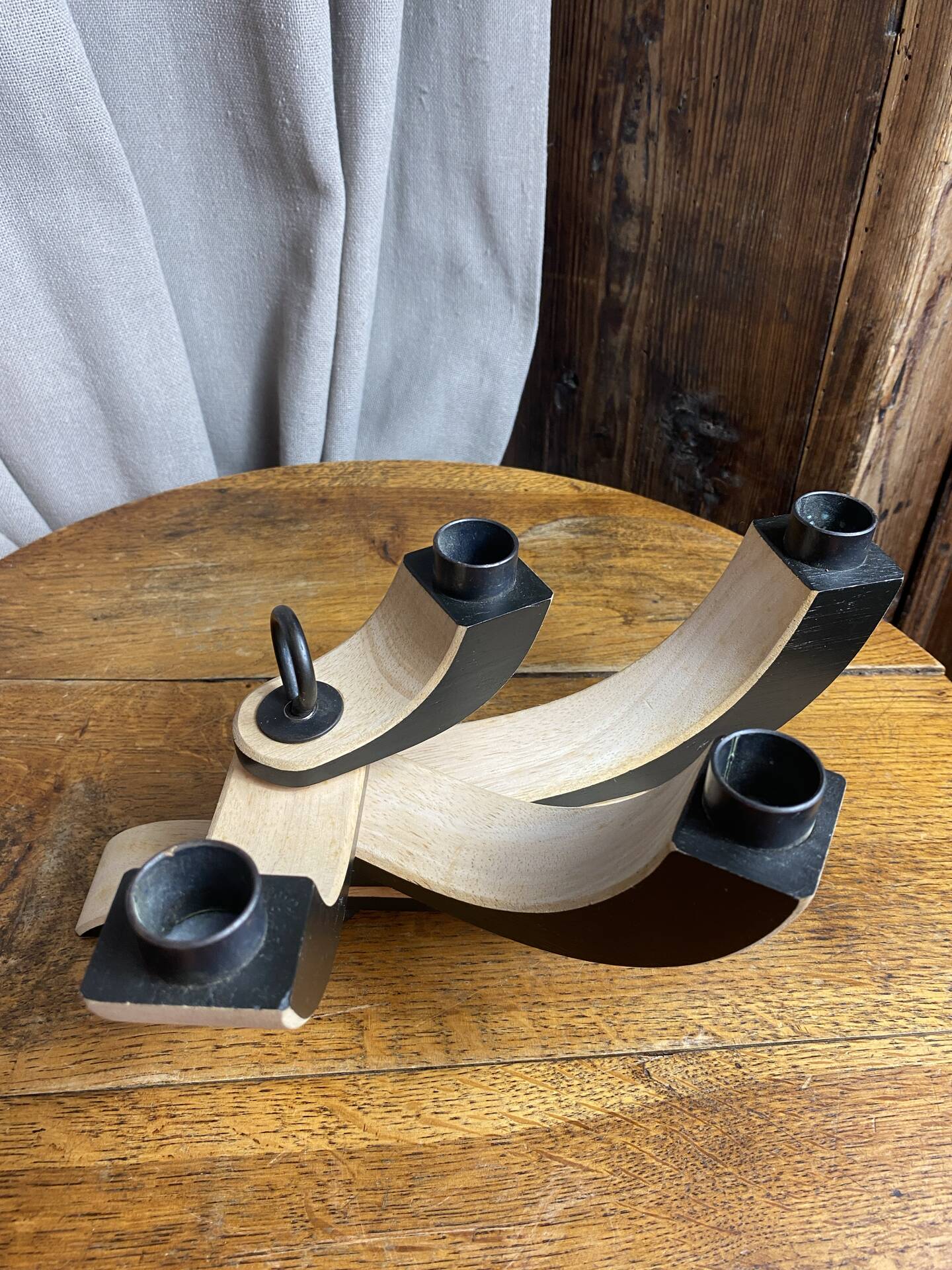 Foldable and deconstructed chandelier, minimalist Swedish design in wood.