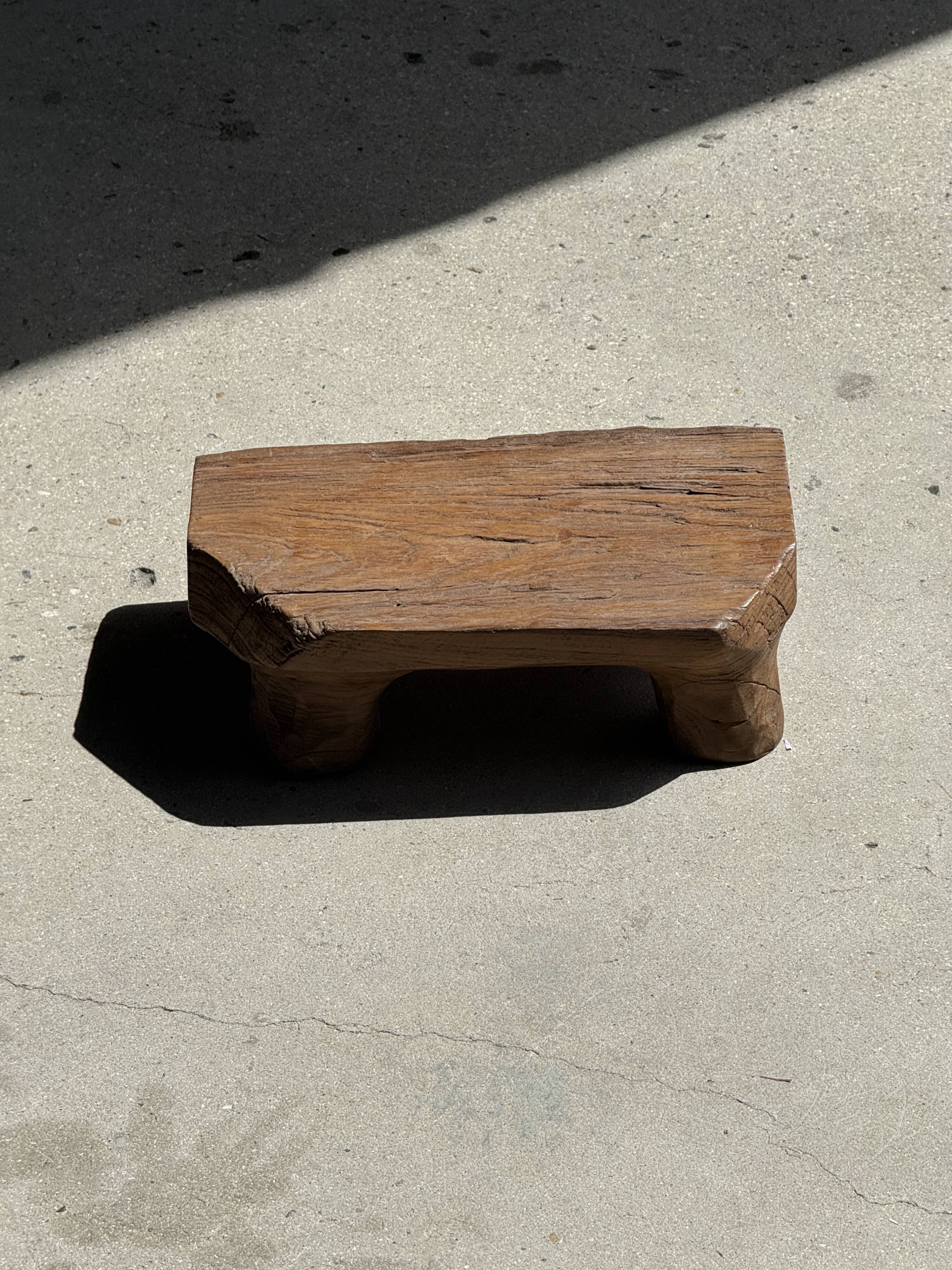 Small stool, teak footrest with short cut corners.