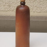 Old enamelled brown sandstone bottle with cork stopper